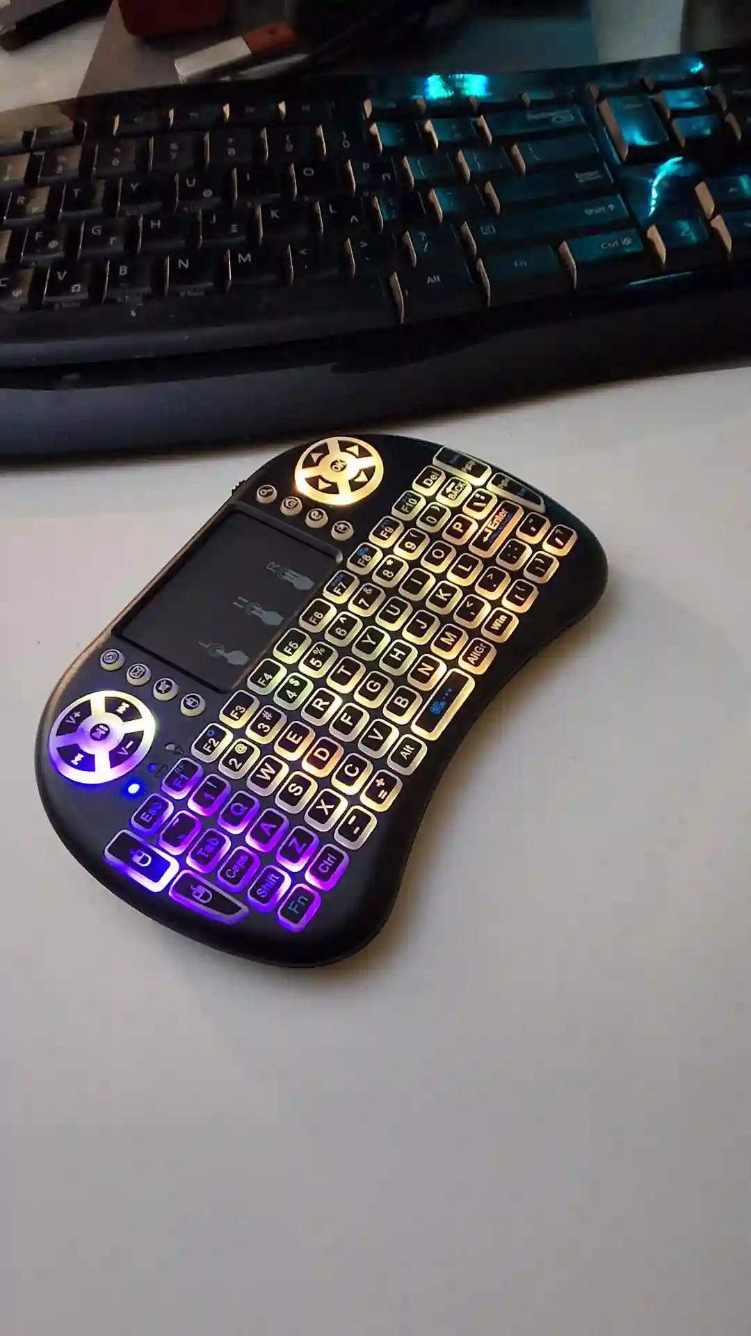 gamepad-styled rgb wireless mini keyboard with touchpad and extra controls and buttons with lit keyboard with many colors