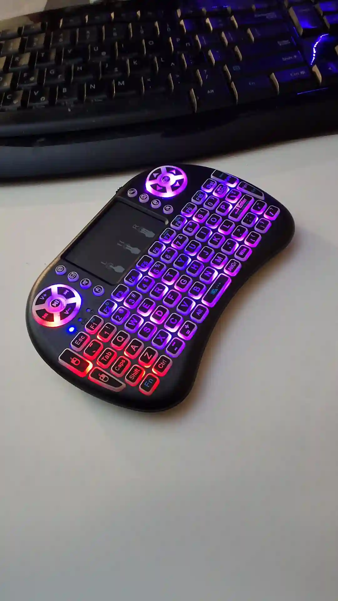 gamepad-styled rgb wireless mini keyboard with touchpad and extra controls and buttons with lit keyboard with many colors