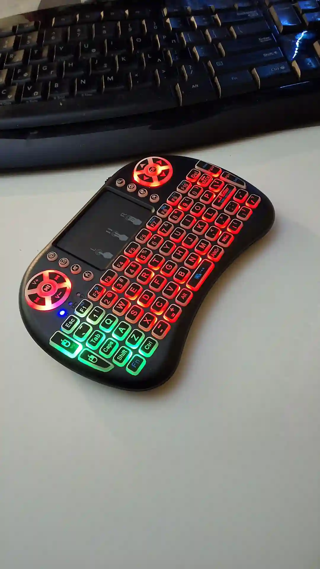 gamepad-styled rgb wireless mini keyboard with touchpad and extra controls and buttons with lit keyboard with many colors