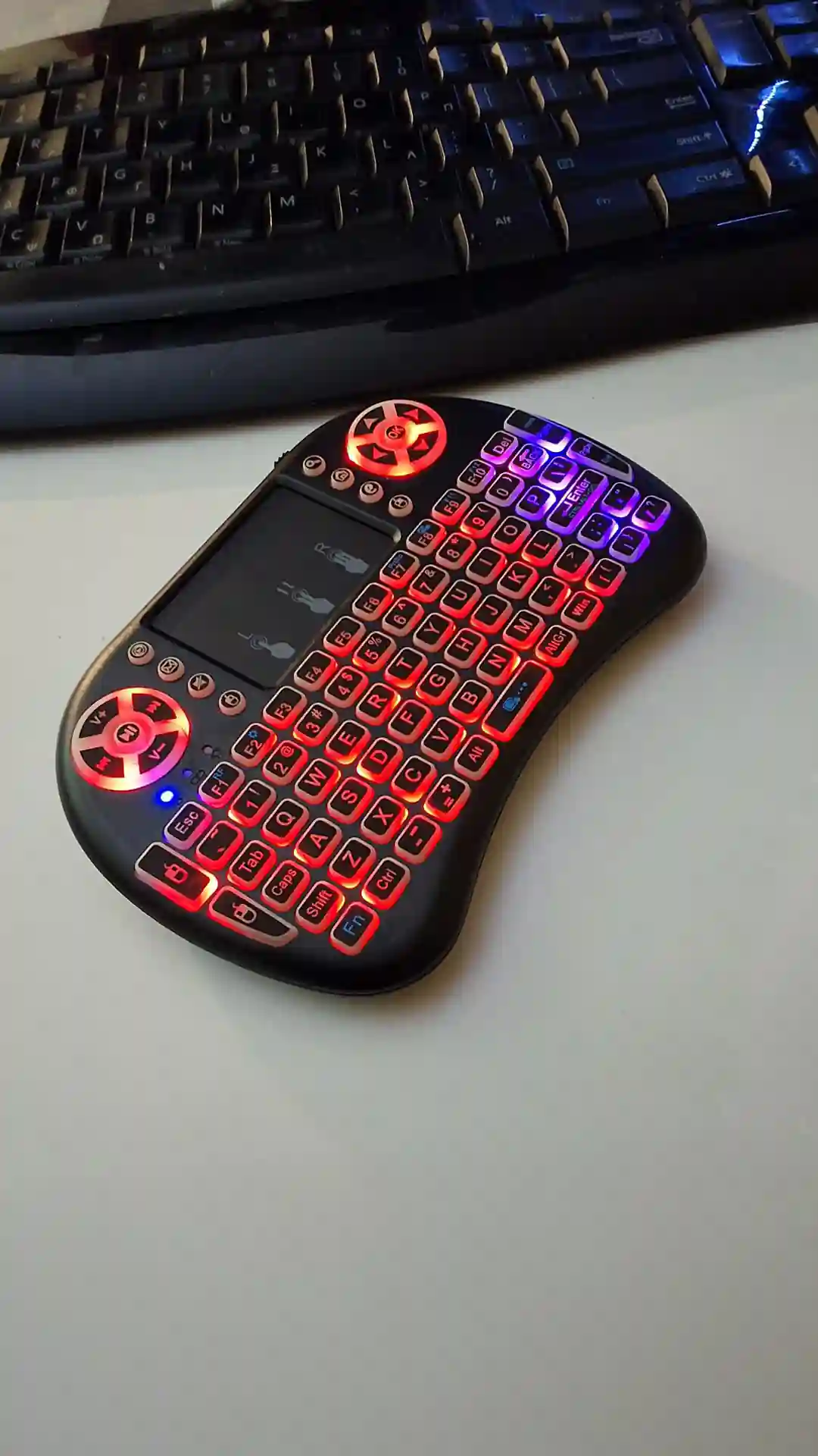 gamepad-styled rgb wireless mini keyboard with touchpad and extra controls and buttons with lit keyboard with many colors