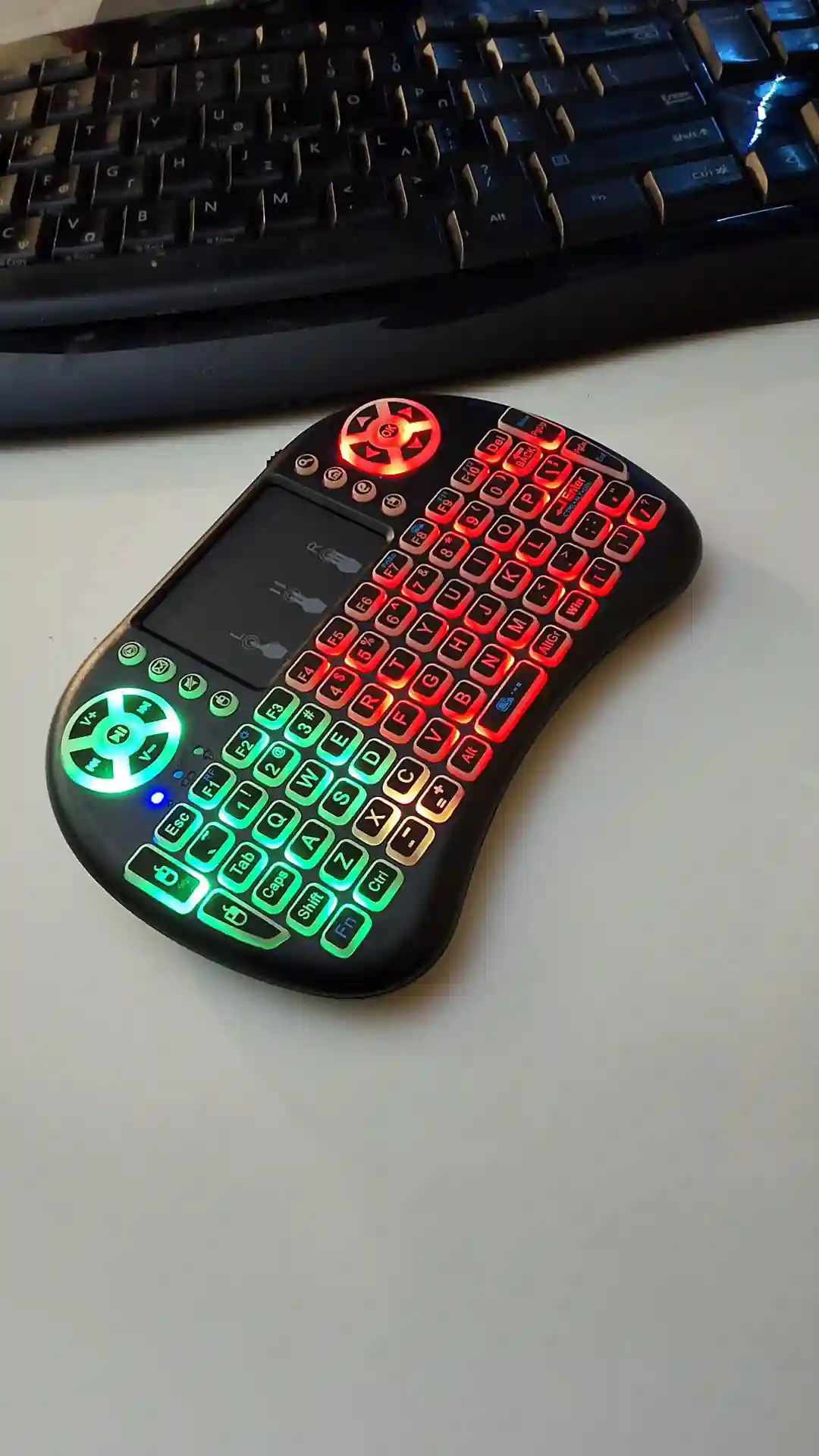 gamepad-styled rgb wireless mini keyboard with touchpad and extra controls and buttons with lit keyboard with many colors