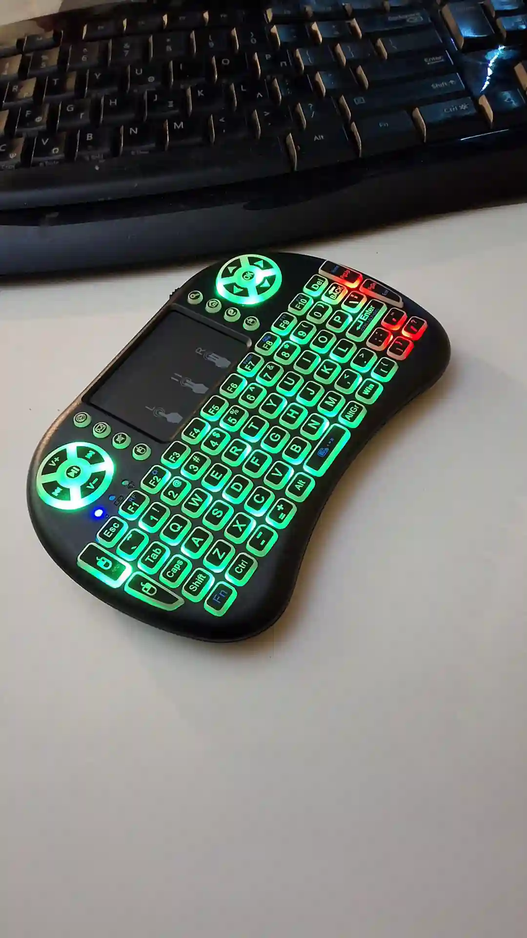 gamepad-styled rgb wireless mini keyboard with touchpad and extra controls and buttons with lit keyboard with many colors