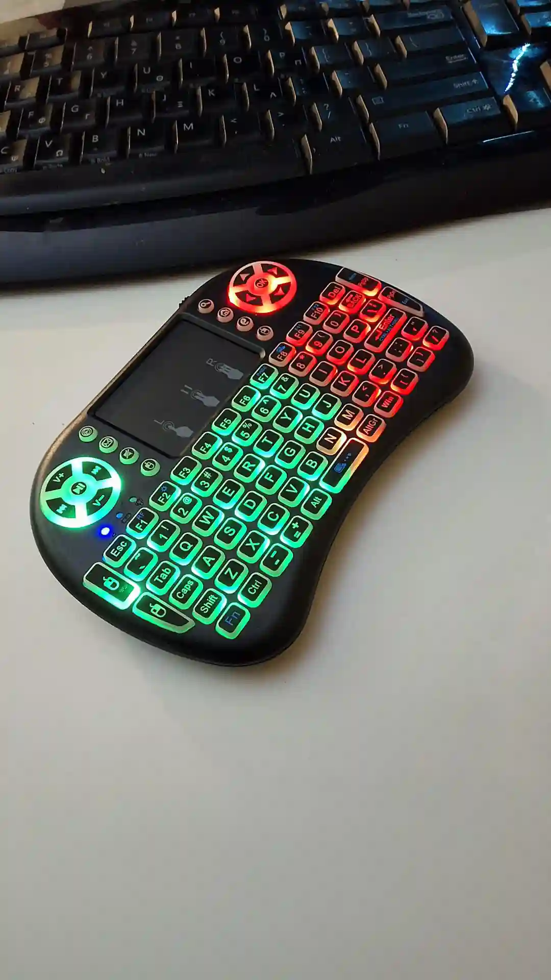 gamepad-styled rgb wireless mini keyboard with touchpad and extra controls and buttons with lit keyboard with many colors