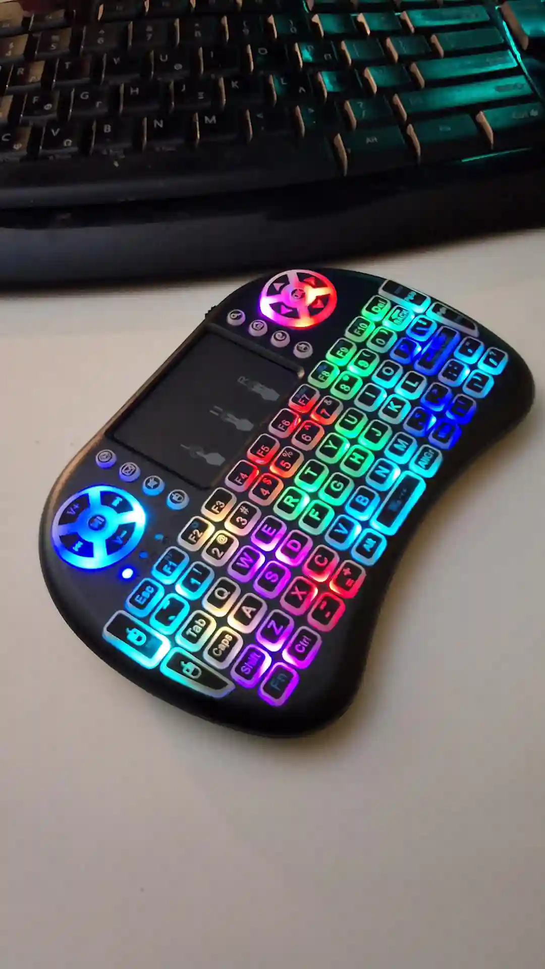 gamepad-styled rgb wireless mini keyboard with touchpad and extra controls and buttons with lit keyboard with many colors