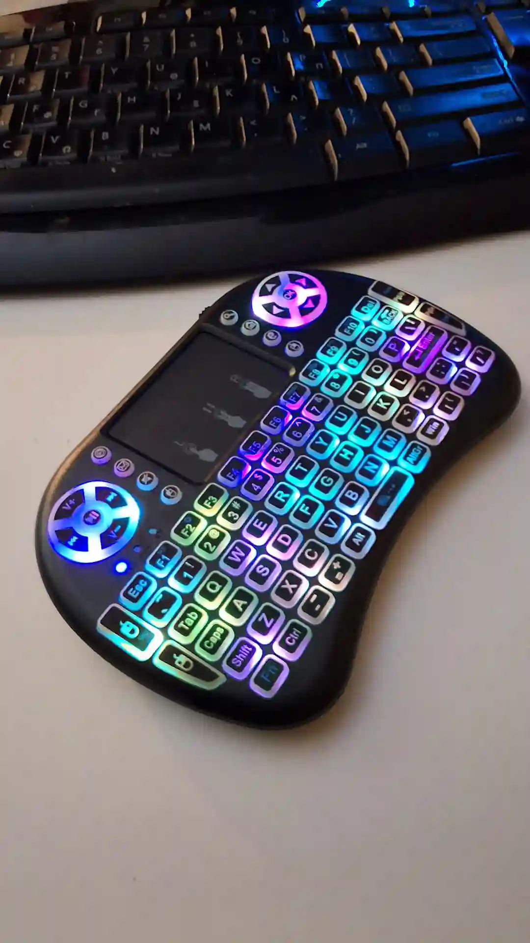 gamepad-styled rgb wireless mini keyboard with touchpad and extra controls and buttons with lit keyboard with many colors