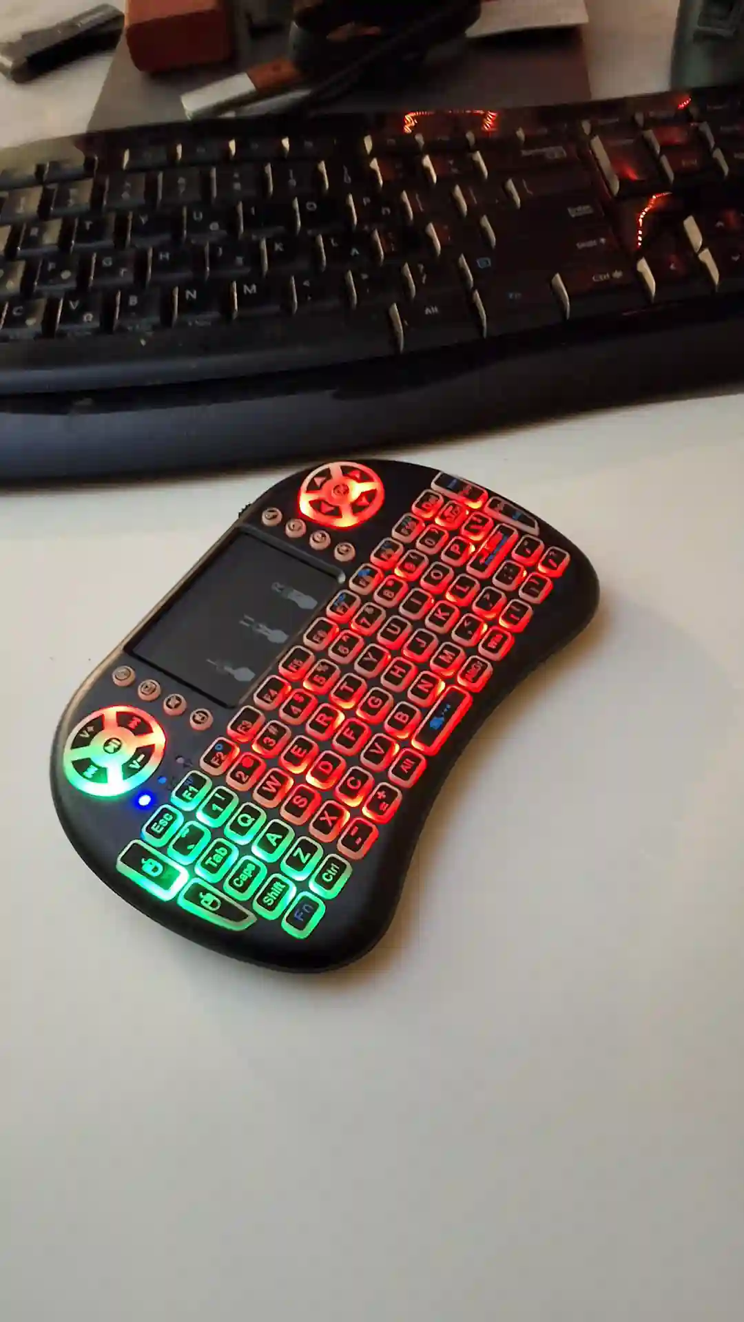 gamepad-styled rgb wireless mini keyboard with touchpad and extra controls and buttons with lit keyboard with many colors