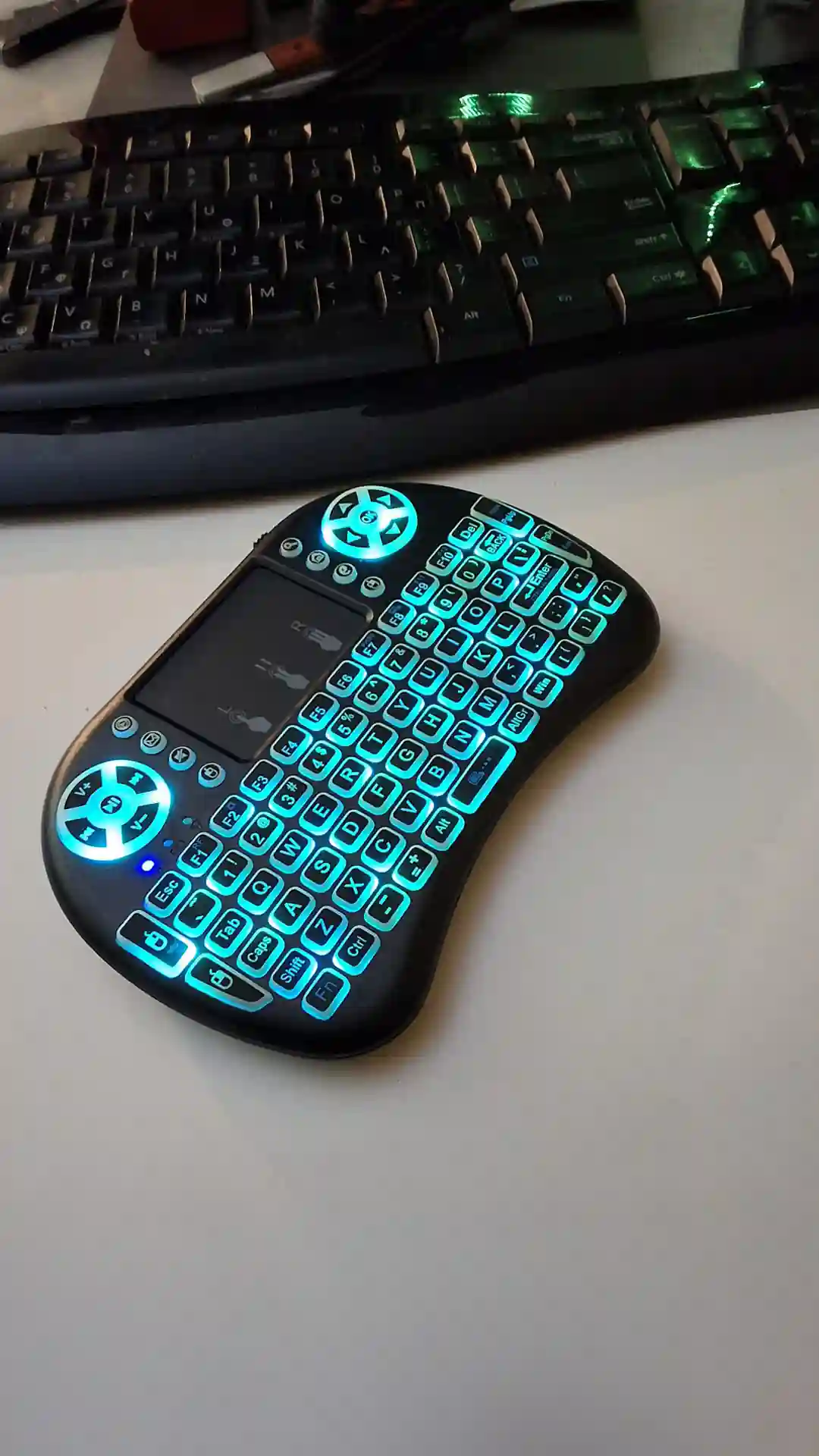 gamepad-styled rgb wireless mini keyboard with touchpad and extra controls and buttons with lit keyboard with many colors