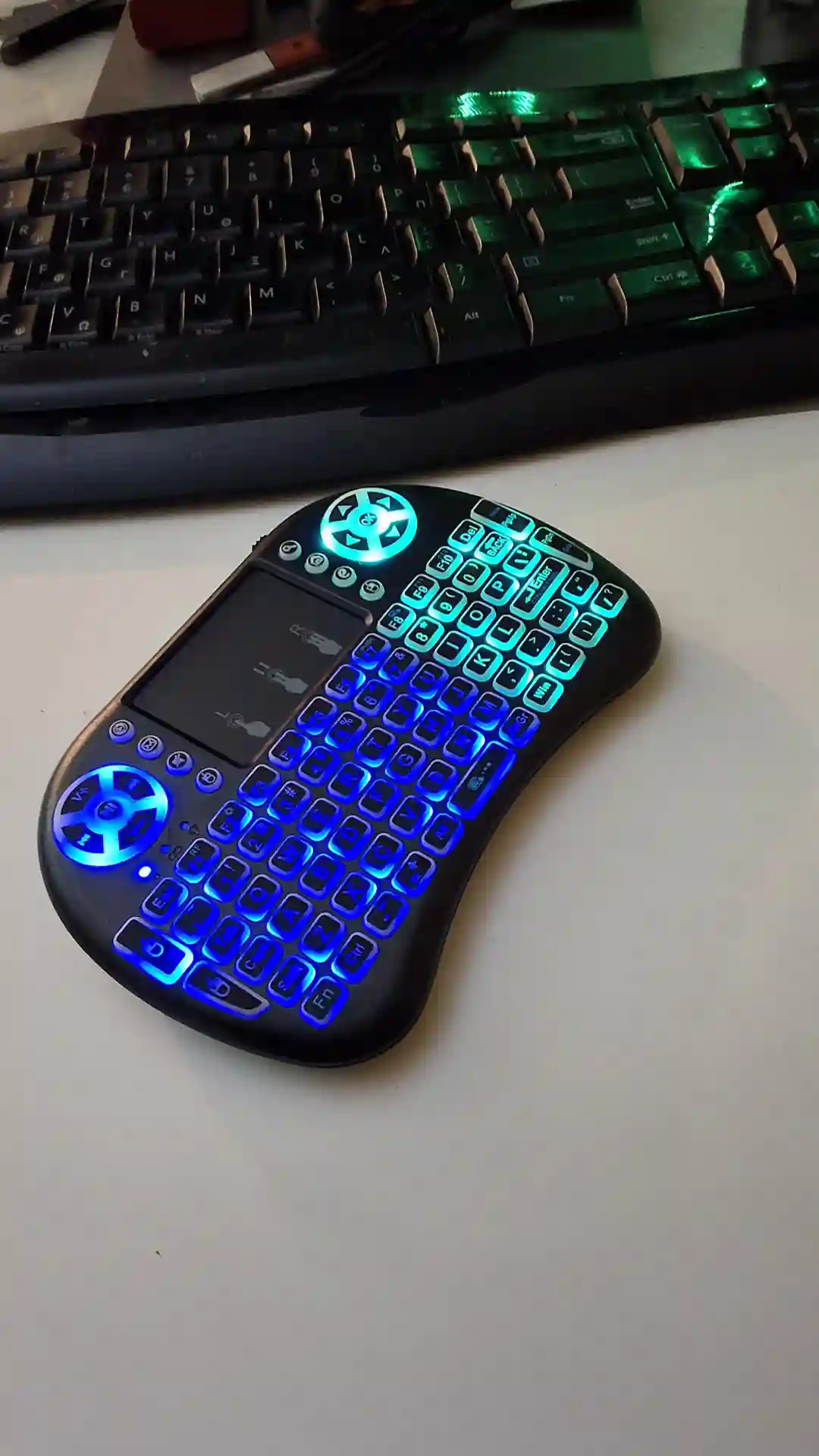 gamepad-styled rgb wireless mini keyboard with touchpad and extra controls and buttons with lit keyboard with many colors