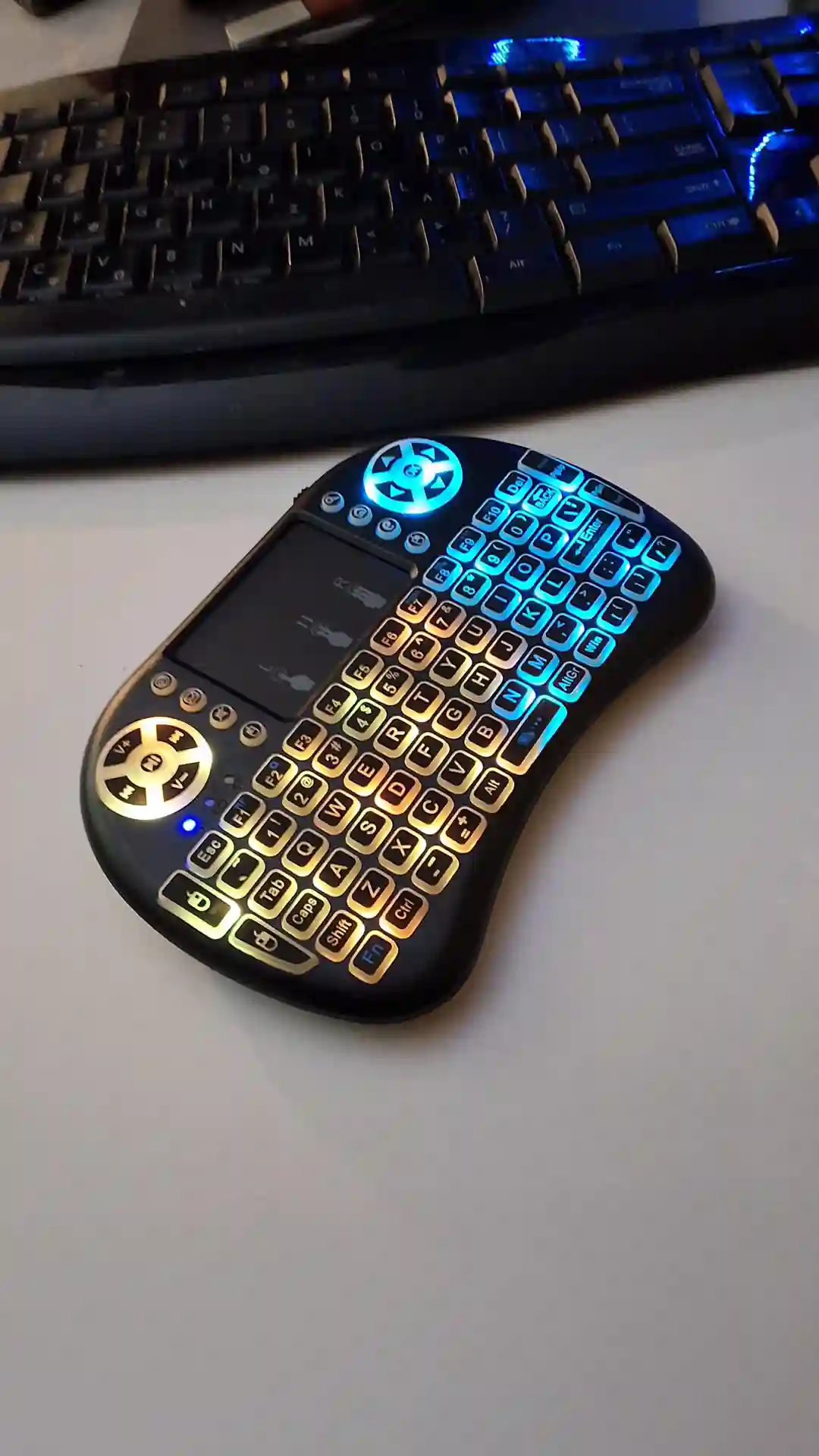 gamepad-styled rgb wireless mini keyboard with touchpad and extra controls and buttons with lit keyboard with many colors