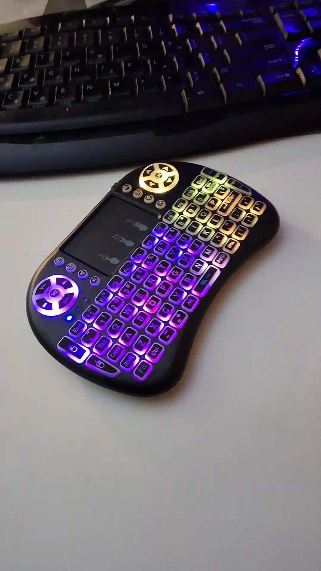 gamepad-styled rgb wireless mini keyboard with touchpad and extra controls and buttons with lit keyboard with many colors