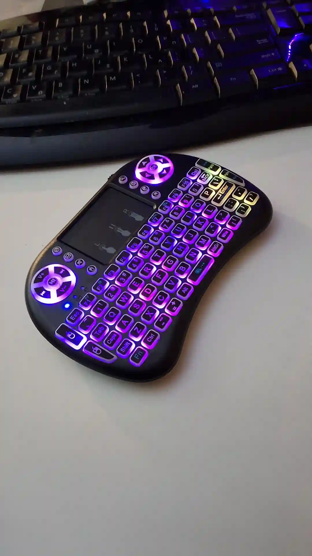 gamepad-styled rgb wireless mini keyboard with touchpad and extra controls and buttons with lit keyboard with many colors