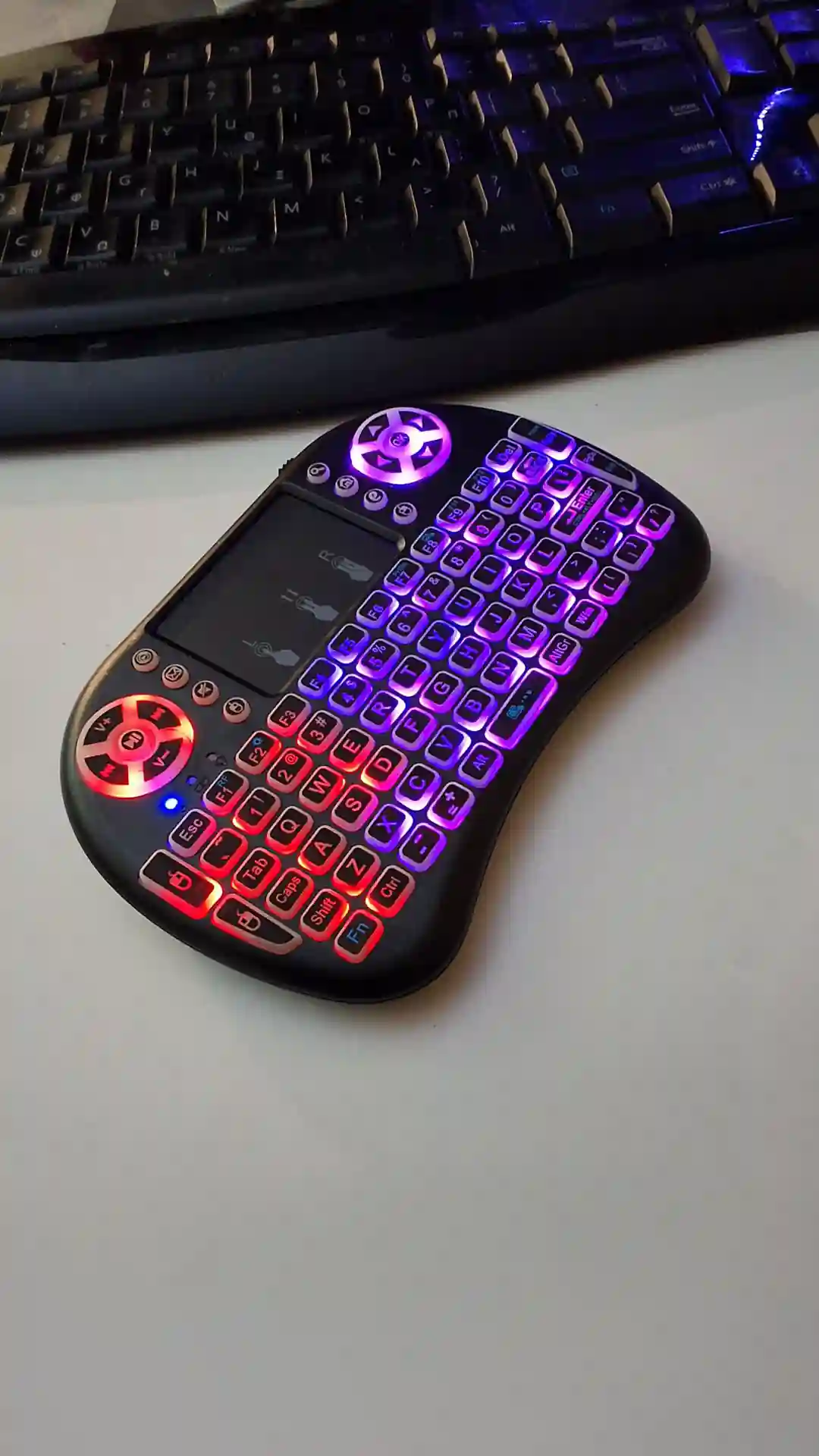 gamepad-styled rgb wireless mini keyboard with touchpad and extra controls and buttons with lit keyboard with many colors